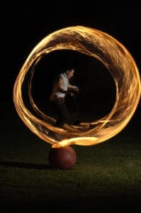 A man is spinning fire on his finger